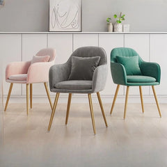 Its softly curved back, vertical channel tufting, and cushioned seat with lumbar support create ergonomic ease for everyday meals or extended seating.