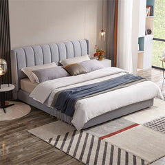 Tall vertical tufted headboard bed and cot in grey fabric with modern bed design look