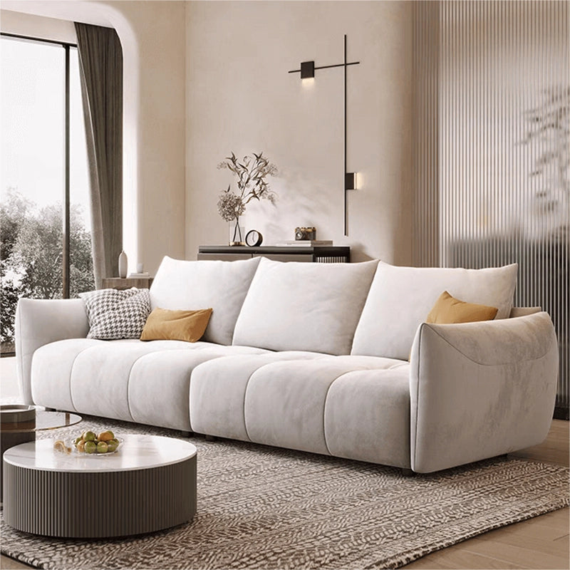 Soft ivory sofa with plush curves + modern sofa design + l shape couch