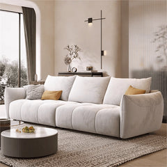 Soft ivory sofa with plush curves + modern sofa design + l shape couch