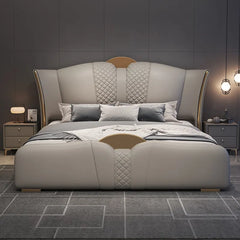 Gold crest accents + master bedroom bed design + sculpted footboard + beige tone