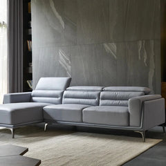 Chrome legs and tufted backrest on premium sofa, pure leather couch in corner shape