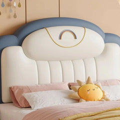 The Marten kids bed brings playful elegance to any children's room with its faux leather headboard embroidered with a rainbow motif and a soft pastel palette.