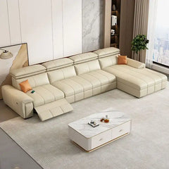 Beige sectional sofa in a living room setting with a coffee table and decor items.