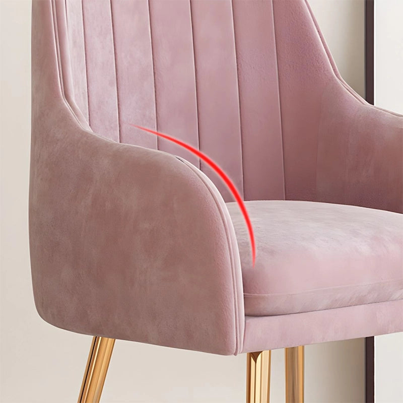 Blending mid-century modern elegance with ergonomic comfort, the Jackal dining chair features a channel-back silhouette, sculpted contours, and plush velvet upholstery in rich shades like blush, teal, or mustard. 
