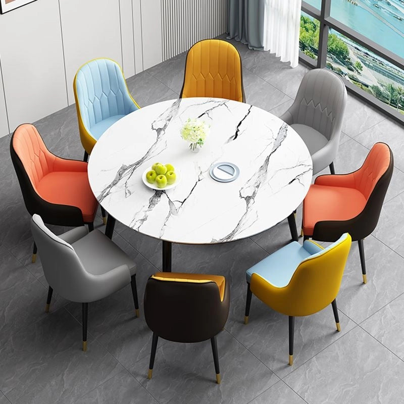 These contemporary dining chairs feature a sculpted parsons-style back, elegant waterfall front seat, and durable faux leather in vibrant dual-tone palettes like navy with black or ivory with brown. 