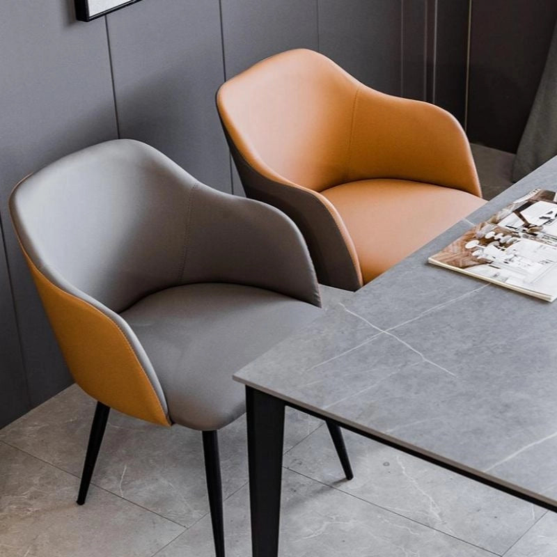 Featuring a softly curved backrest and integrated arms, it blends aesthetic balance with functional support. 