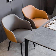 Featuring a softly curved backrest and integrated arms, it blends aesthetic balance with functional support. 