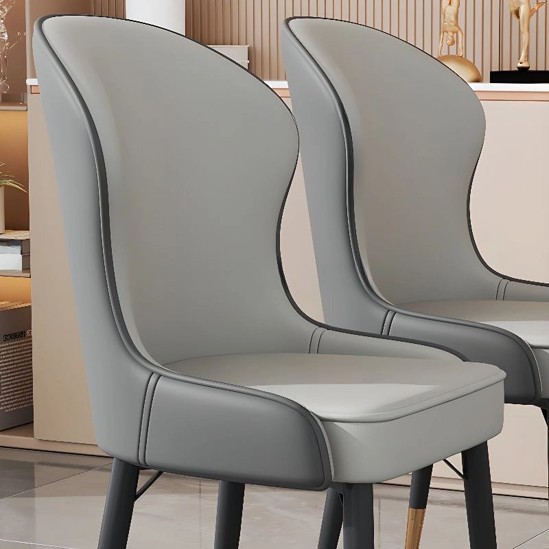 Ideal as part of a set of dining chairs or dining chairs set of 6, it rests on powder-coated black tapered metal legs that combine strength with modern elegance. 