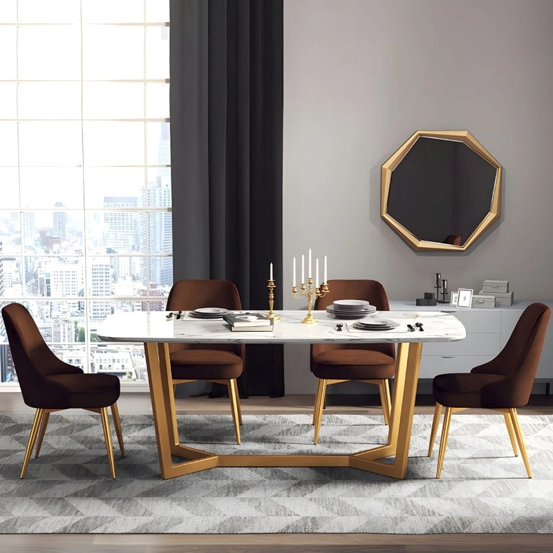 Its armless frame and plush contoured seating create a comfortable dining experience, while the tapered gold-toned metal legs ensure stability and visual contrast.