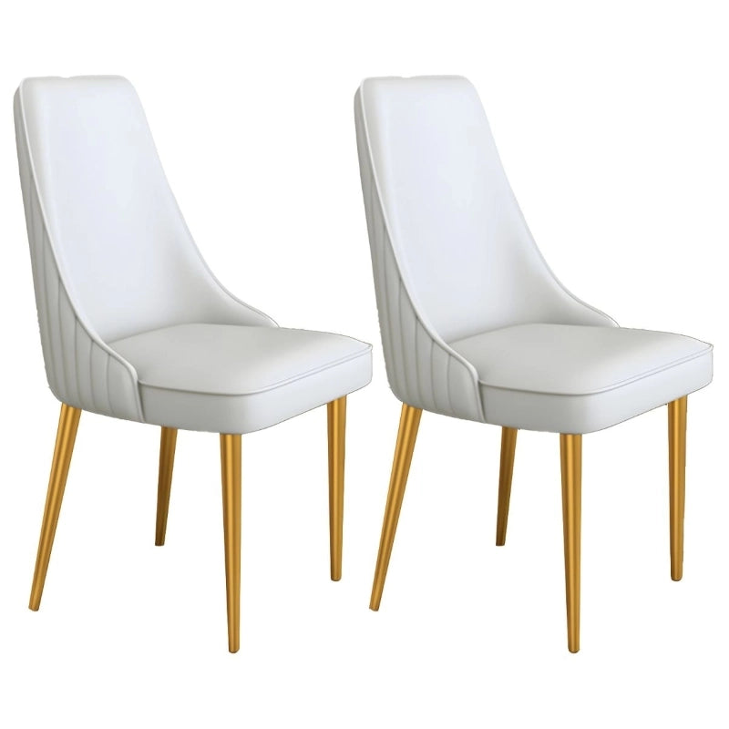 Metallic gold-finished legs add a luxe accent to its otherwise minimalist form.