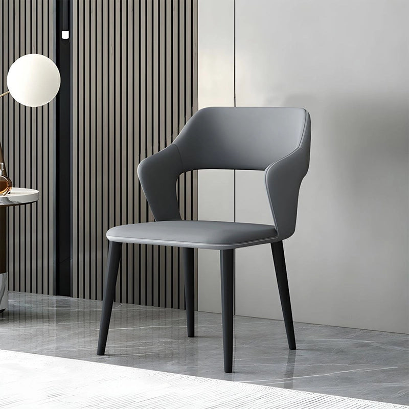 Featuring soft PU leather in dual-tone hues and a curved ergonomic back with integrated arm support, these dining chairs add a luxurious touch to any dining space