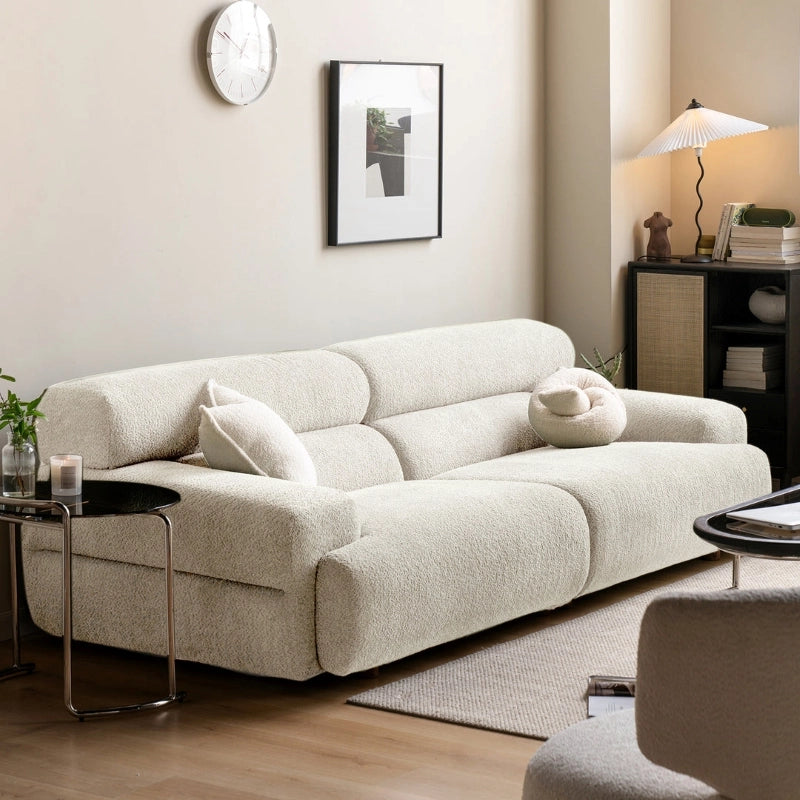 he 3 seater couch showcases deep fixed cushions, rounded armrests, and low stub legs that visually anchor without dominating space. 