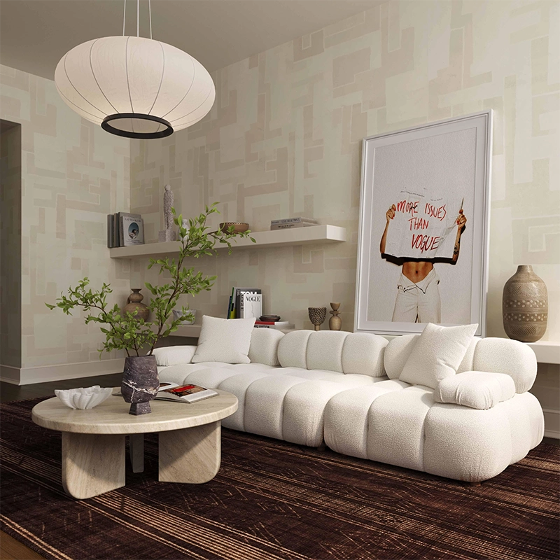 Modern living room with a white sofa, coffee table, and decorative items.