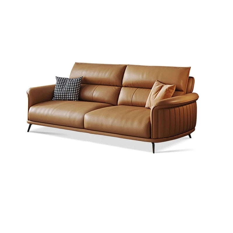  Crafted from high-quality pure leather, this contemporary sofa design features gently curved arms with vertical stitching, ergonomic backrests, and smooth piped edges — ideal for stylish, family-safe lounging. 