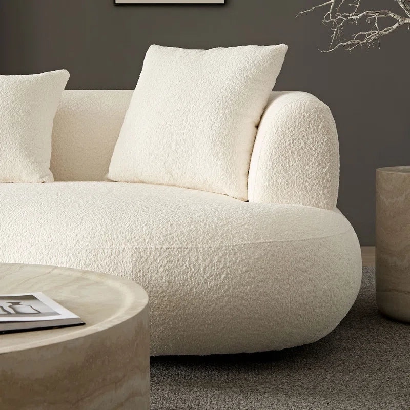 Upholstered in bouclé fabric and reinforced with premium pine and plywood, it’s durable and pet-friendly.