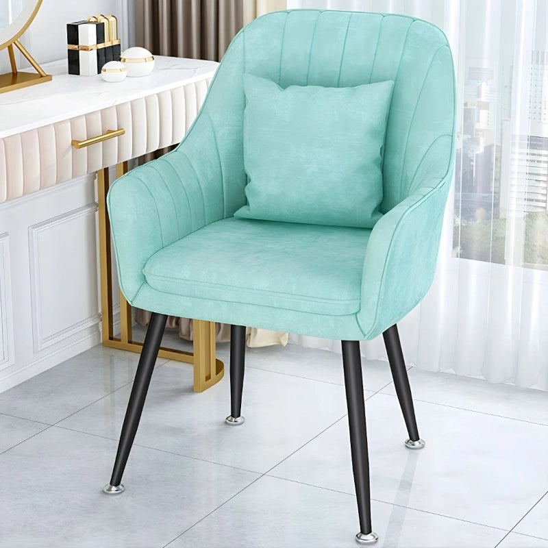 These dining room chairs feature plush velvet upholstery with vertical channel-back stitching, comfortable armrests, and supportive seat padding, making them perfect as armchairs for dining tables.