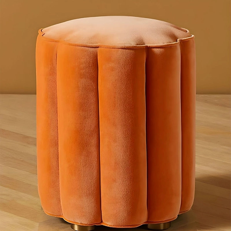Milan is a contemporary round pouffe ottoman with a sculpted scallop edge, ideal for low seating or soft accent use