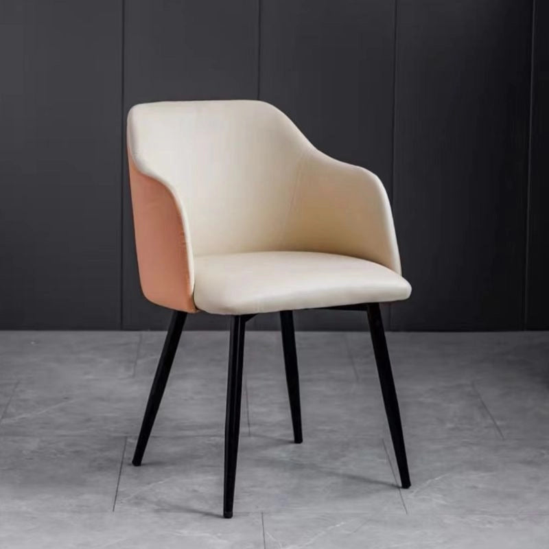 These dining chairs set of 6 feature a dual-tone faux leather or fabric finish, ergonomic backrest with built-in arms, and sleek tapered metal legs for both comfort and durability. 