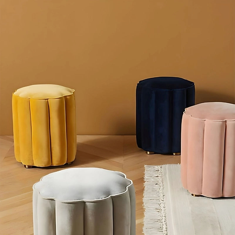 Upholstered in velvet and built from Neem wood and engineered panels, its plush surface is enhanced by vertical channel stitching and a supportive foam core. 