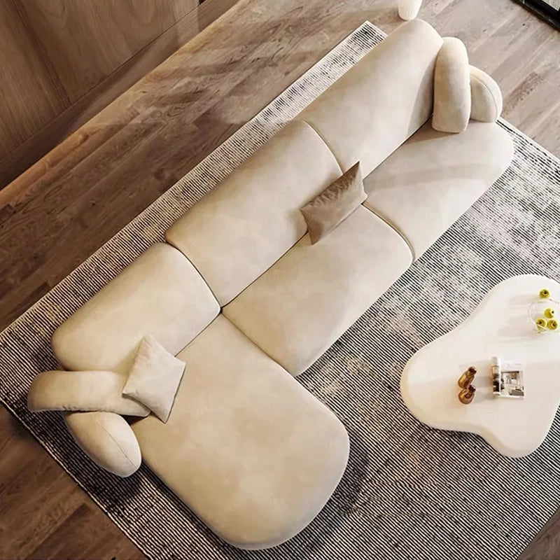 The Silenus couch collection redefines modern comfort with its distinctive low-profile shape and sculptural curves. 
