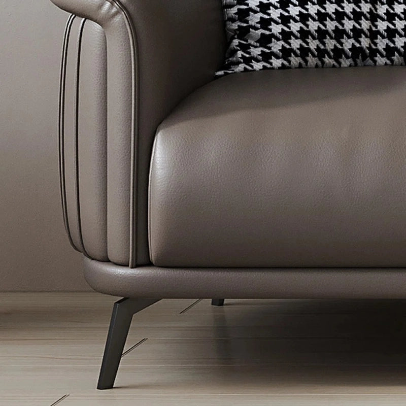 Genuine leather upholstery in earth-toned hues like taupe and caramel complements both minimalist and luxury interiors.