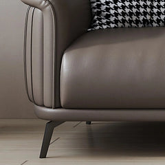 Genuine leather upholstery in earth-toned hues like taupe and caramel complements both minimalist and luxury interiors.