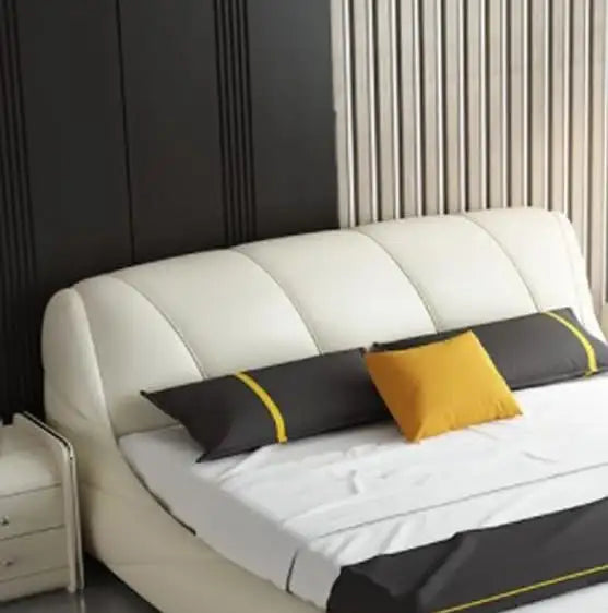 Low-profile tan bed with chrome legs featuring bed and cot styling and bed frame silhouette