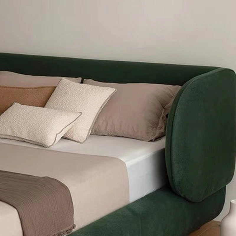 This sculpted upholstered bed merges form and function in a seamless modern bed design.