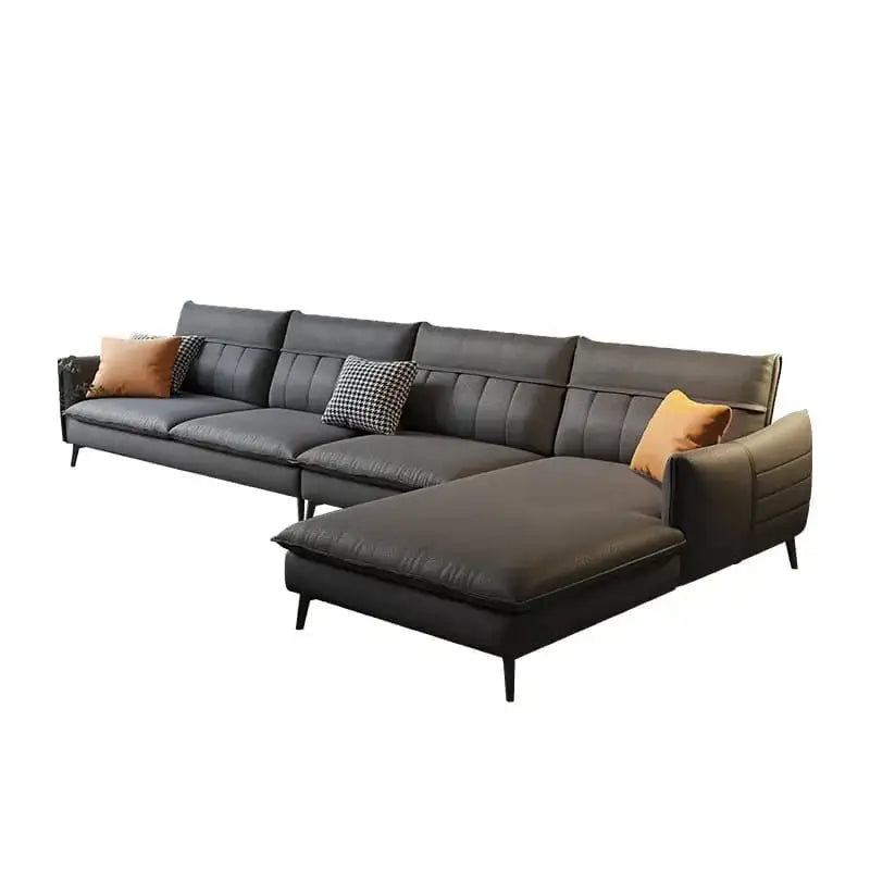 Gray sectional sofa with cushions on a white background