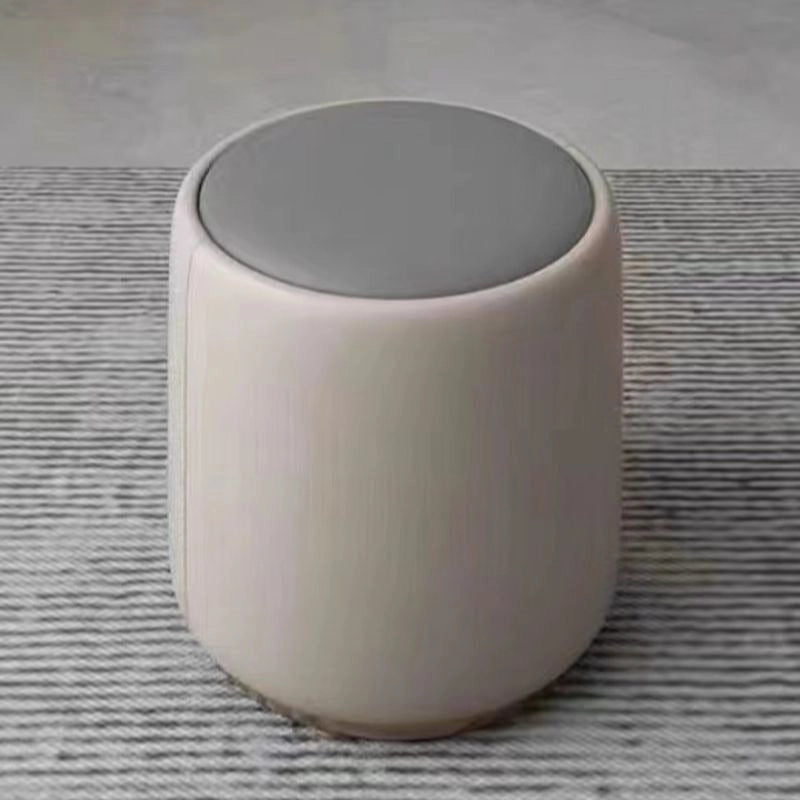 Compact grey ottoman with pouffe ottoman style, beige fabric body, modern decor

