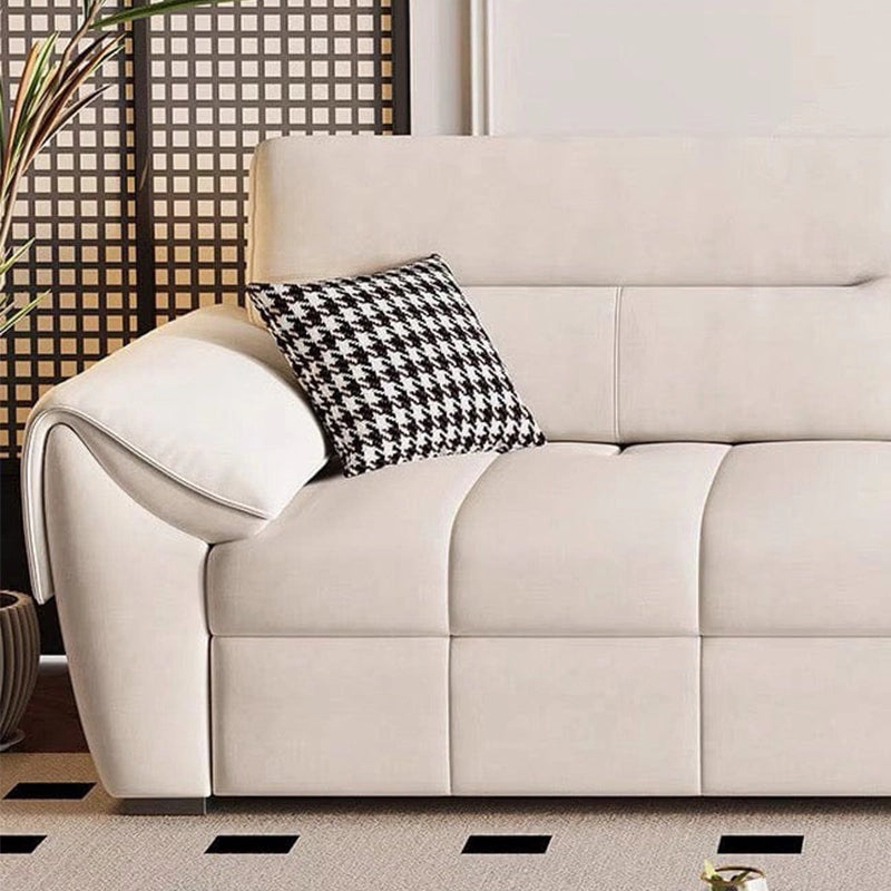 Upholstered in soft woven fabric available in beige, charcoal, grey, and green, this low-profile couch features plush cushioning and overstuffed arms for added comfort.