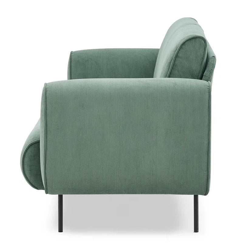 Strider is a thoughtfully designed 3-seater couch upholstered in sage green corduroy, ideal for Indian urban homes. 