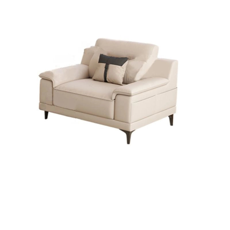 Beige armchair with a pillow on a white background