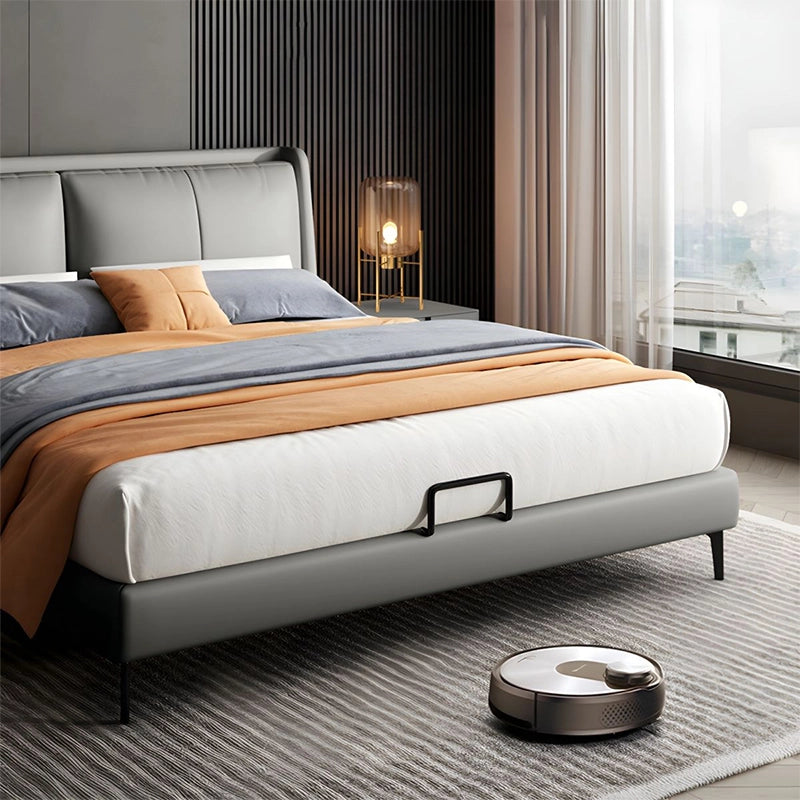 Upholstered in matte-finish leatherette, it features a softly padded wingback headboard with clean vertical stitching. 