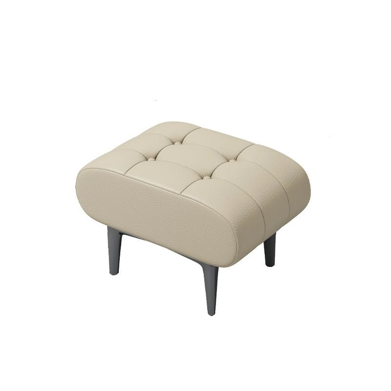 The pebbled faux leather surface in tan offers tactile appeal, while deep channel tufting enhances visual texture.
