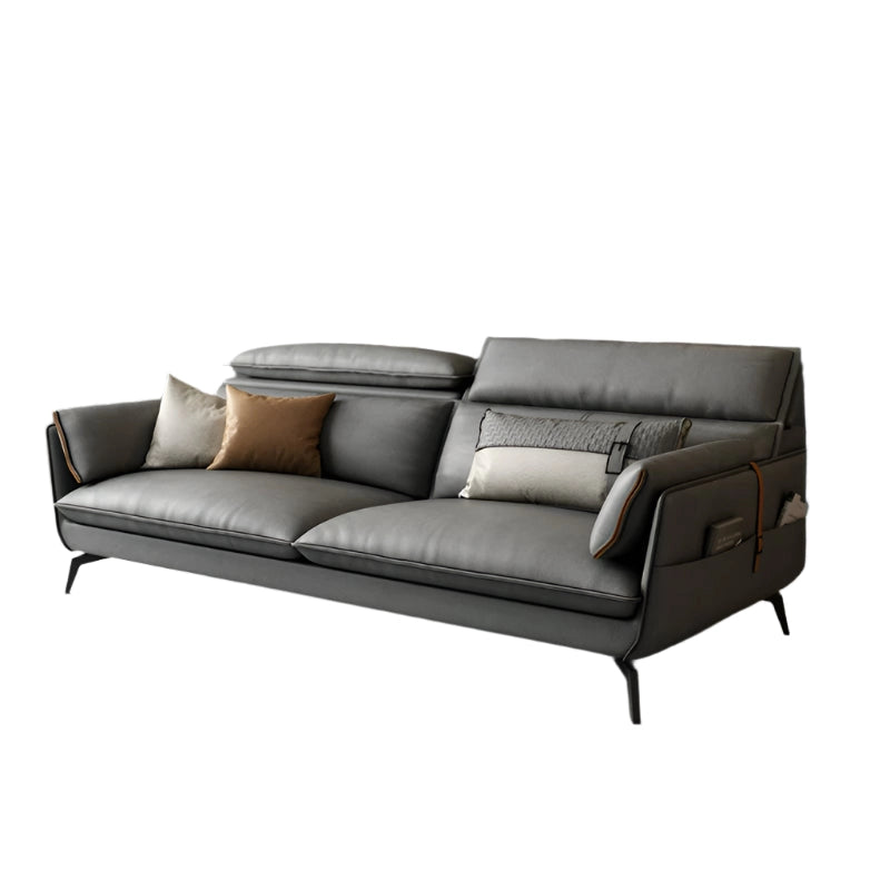 The soft, adjustable headrests and deep, structured cushions create a balanced seating experience, while integrated side pockets and tapered legs enhance both style and practicality. 