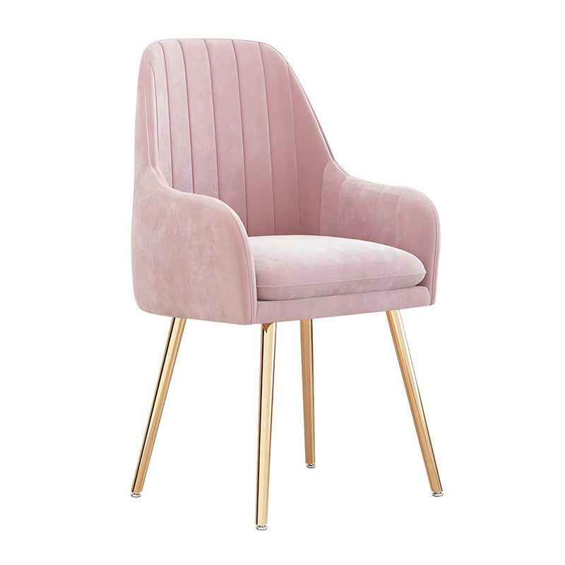 Add a splash of modern luxury to your space with this stunning dining chair featuring plush velvet upholstery, gold or black tapered legs, and stylish channel-tufted detailing.