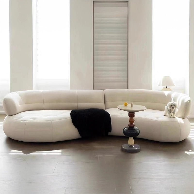 The Sterling sofa is a sculptural, luxuriously curved settee that redefines modern seating.