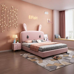 Plush bunny ears and embroidered eyes children’s bed with mattress pink wood base