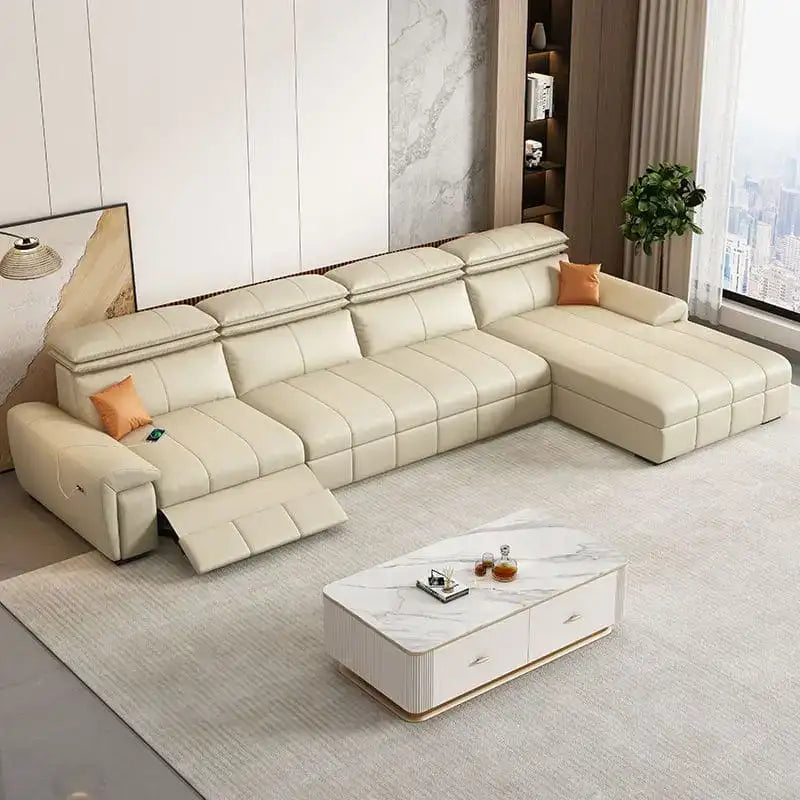Beige sectional sofa in a living room setting with a coffee table and decor items.