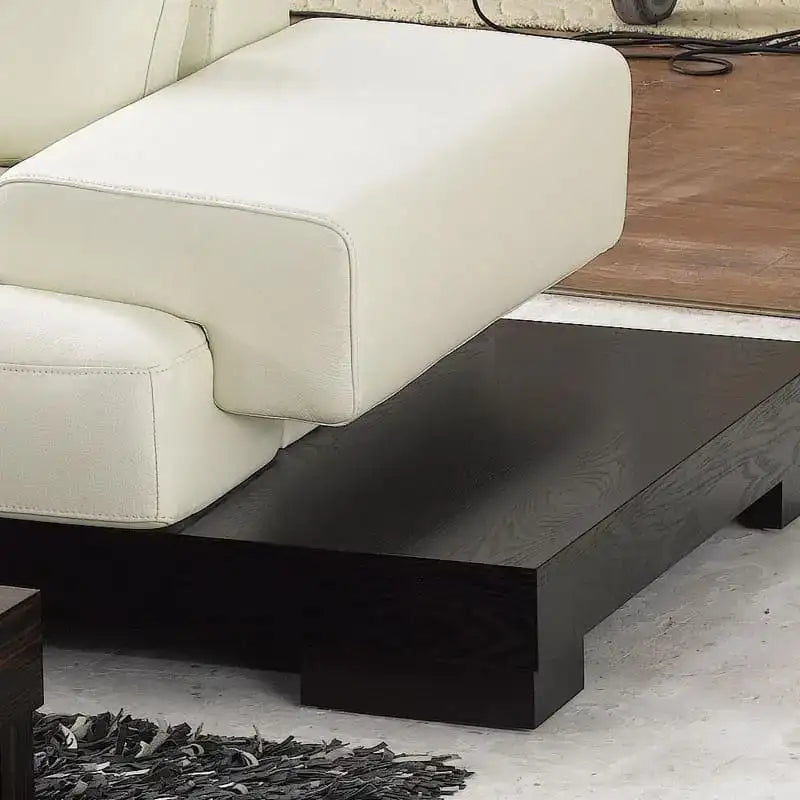 Dark wood platform base with horizontal seat tufting, leather couch, premium sofa